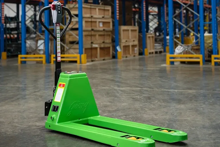A Godrej lithium-ion electric hand pallet truck in a warehouse